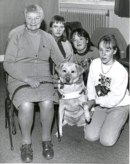1991: Guide dog Heidi was the centre of attraction when her mistress Miss Isobel Mundie visited Aberdeen College of Further Education's Ruthrieston Centre. Students on the special educational needs extension course have been collecting foil and used stamps in support of Guide Dogs for the Blind and Miss Mundie called to receive them. With them are students Brenda Hay (right), Davene MacDonalds (centre) and Mairi Kinnaird.