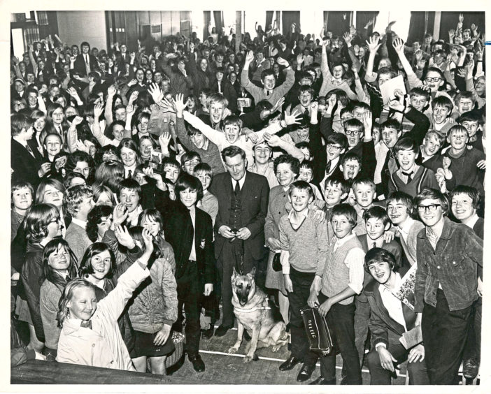 1970: Pupils of Summerhill Secondary School, Aberdeen, easily beat their target of £250 a train a guide dog for the blind under the Pearl Murray Project. At a ceremony in the school hall yesterday Miss Margraet Benson, of the Guide Dogs for the Blind Association, presented the school with a statuette, which is being held aloft by Keith Buchan, of Class 1G, as the other pupils cheer. In the centre of our picture with Miss Benson is Mr Alex Duguid, Scottish area organiser, with his dog, Shuna.