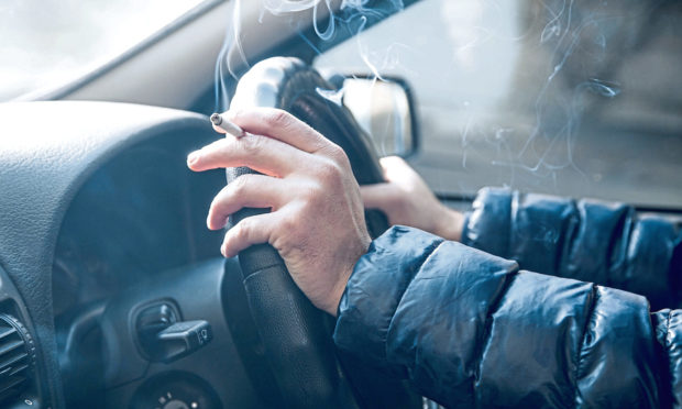 Man smoking at the wheel