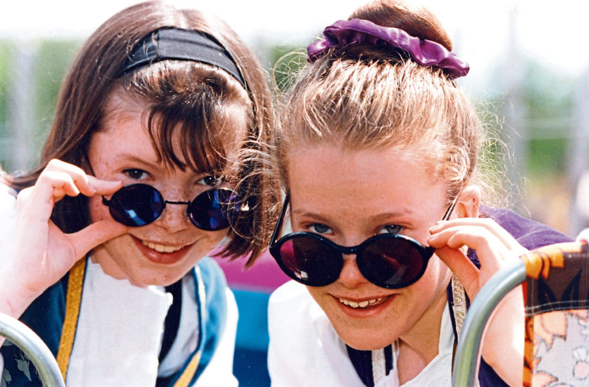 1993 - Young Highland dancers Julie Meston, left, Stonehaven, and Louisa Smith, Catterline, both 13, enjoy the sunshine before taking part in Aberdeen Highland Games