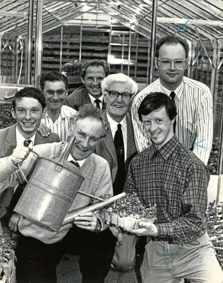 1989 - Robbie Shepherd helps to keep the plants growing with the  aid of trainee farm worker Jim Spiers
