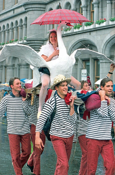 1997 - Sailors and a swan figurehead join the parade  down Union Street leading to the harbour