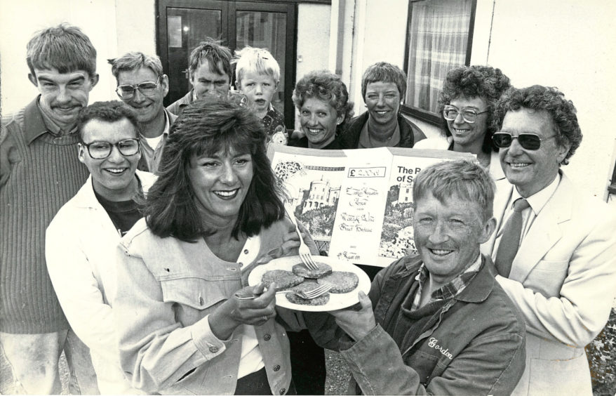 1991 - Gordon Simpson, front right, has a burger with  Laura Keil who raised £230 at a barbeque