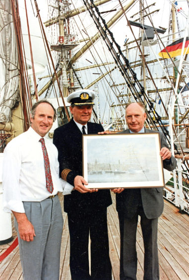 1991 - Tadeus Olechnowicz, centre, of Polish  vessel Dar Mlodziezy, receives a signed print  by marine artist Edward Walker, left, and  Aberdeen Chamber of Commerce  chief executive Derek Marnoch