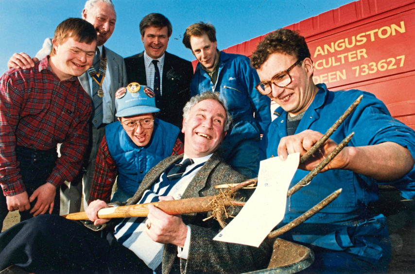 1992 - Forking out a £3,000 cheque on behalf of St Fittick Rotary  Club is radio celebrity Robbie Shepherd to Grant Rowson