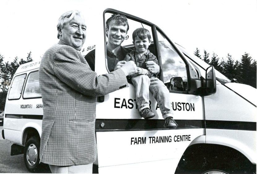 1989 - Dons hero Alex McLeish and Jamie McVeigh, three,  accept minibus keys from Norco boss Sydney Fyfe
