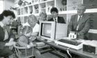 1990 - Melanie, 2, takes a keen interest in the screen of a computer bought for the Raeden Centre with a £1000 donation from the Halifax Building Society