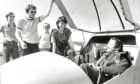 1982 - Donald Mackenzie holds the canopy for wife Susan, who was taking her second training trip in a glider and is pictured with, from left, solo pilots Mark Bissett and Willie Stephen, and the Deeside Gliding Club’s instructor Alan Middleton