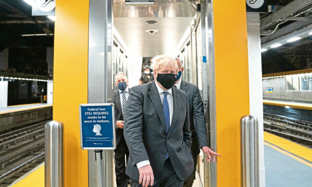 Prime Minister Boris Johnson prepares to board a train from Penn Station in New York to Washington DC where he will meet US President Biden later today.  Picture date: Tuesday September 21, 2021.