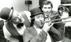 1990 - Gregor Fisher of Rab C. Nesbitt fame starts the celebrations with a tune at the official opening of Headland Properties’ Headland House, as managing director Hamish Milne, right, and jazz band leader Alex Sutherland cheer him on 