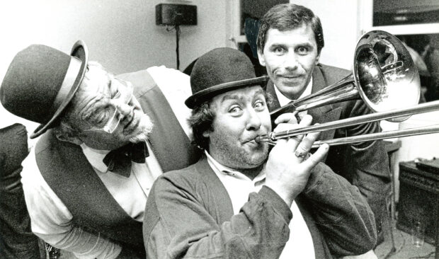 1990 - Gregor Fisher of Rab C. Nesbitt fame starts the celebrations with a tune at the official opening of Headland Properties’ Headland House, as managing director Hamish Milne, right, and jazz band leader Alex Sutherland cheer him on 