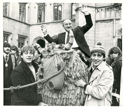 1985 - After his installation as Rector of Aberdeen University, Hamish Watt is carried by his supporters on the charities mascot Angus across to the Kirkgate Bar for the traditional refreshments