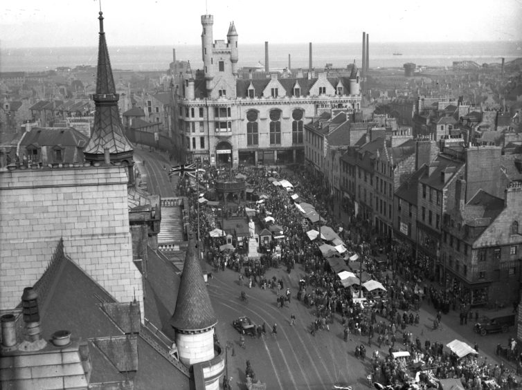 Hundreds of North-east folk flocked to the Timmer Market in Aberdeen's Castlegate in August 1934. The Timmer Market had been held annually in Aberdeen for one day in August since before 1773. Until 1934 it was set up in the Castlegate, but from 1935 was held on the market stance off Justice Street.