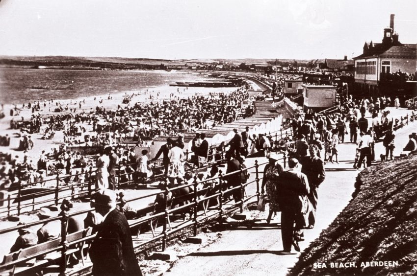 The beach has always been a popular spot, though it was not until the 20th century that the area was significantly developed and promoted. This George Washington Wilson photograph from the late 19th century shows bathers enjoying the fresh air and bracing waters in an earlier period.