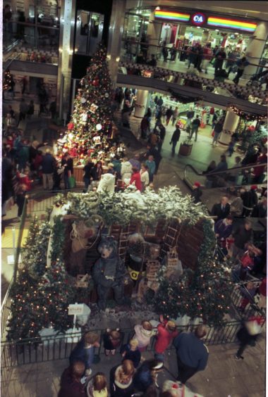 1996: Christmas decorations and Christmas trees to cheer up shoppers.