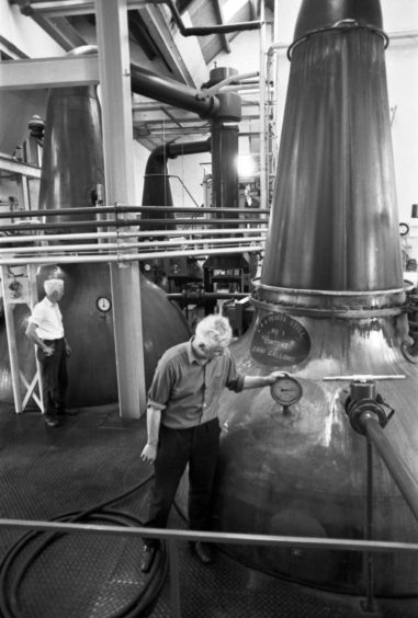 1974: Stillman Mr FS Kerr and mashman  Mr D McArthur at work in the stillroom of Fettercairn Distillery