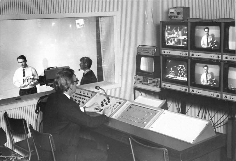 1971: Aberdeen College of Education staff get to know their new service: chemistry lecturer Mr William MacKenzie demonstrates in the studio. In the gallery, Mr Crossan selects from the monitor screens what will appear on the video-tape recording.