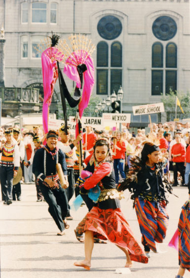 1991: Odori Japanese Dancers cavort along Union Street as the Aberdeen International Youth Festival gets underway.