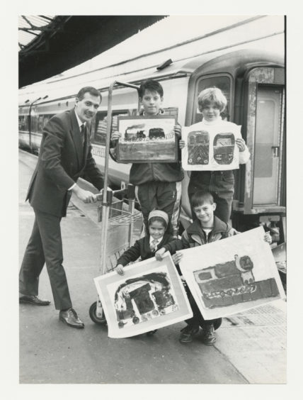 1992: ScotRail’s Aberdeen service manager, Steve Montgomery (left) gives a lift to the winders of the schools’ painting competition held to celebrate the 125th birthday of Aberdeen Station.