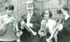 The winner of the trumpet under-15s section, Lesley Anderson, second left, with fellow competitors