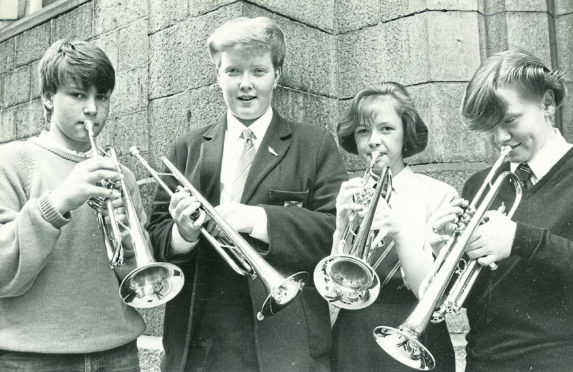 The winner of the trumpet under-15s section, Lesley Anderson, second left, with fellow competitors