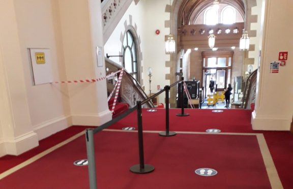 Social distancing measures, such as markings and barriers, have been erected at Aberdeen Sheriff Court