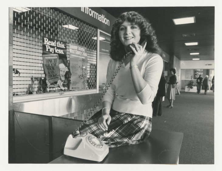 1980: Telephonist at Aberdeen railway Station, 19-year-old Susan Watt, will be one of the voices to records the new timetable message.  Susan poses with a telephone in the stations Information Centre.