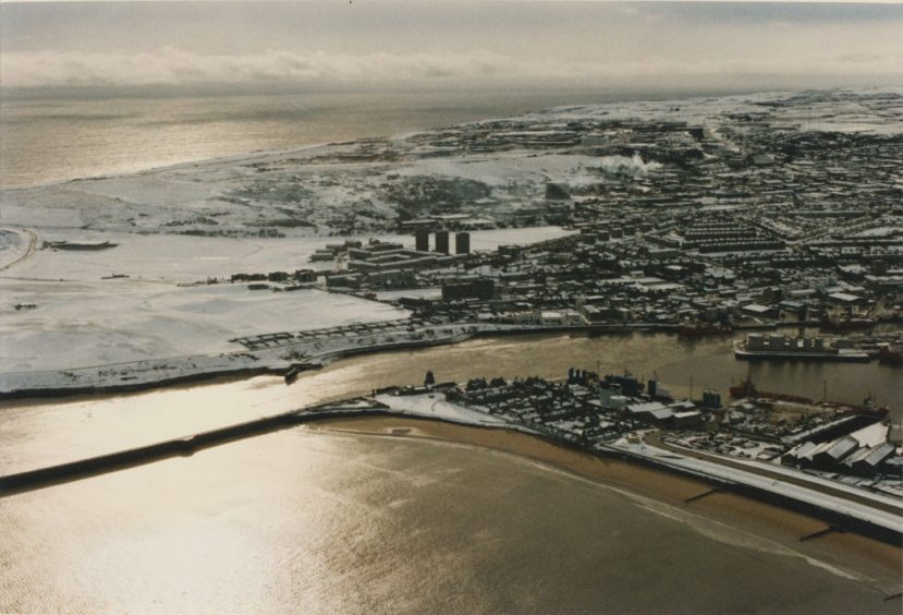 1993: Looking south over Aberdeen covered in snow with Footdee in the foreground.