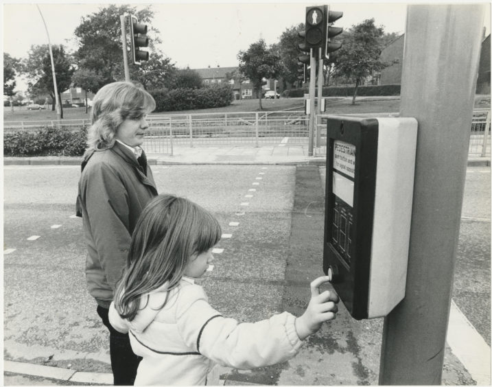 Mrs Tait and her daughter, Donna, about to cross the traffic on the new pedestrian crossing on Anderson Drive, near Provost Fraser Drive.  5 October 1988.