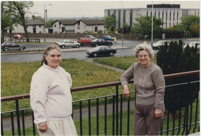 Residents of North Anderson Drive, Aberdeen, Mrs Alice Bailey (left) and Mrs Connie Reid, watch the traffic at the junction where they believe a fatal accident is inevitable.  27 May 1991.