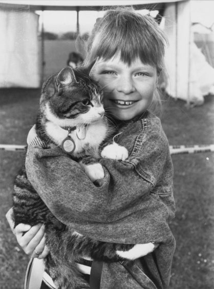 1986: Joy Mennie with her cat Kizzy, first in the cats section at Cove Bay Gala pets parade.