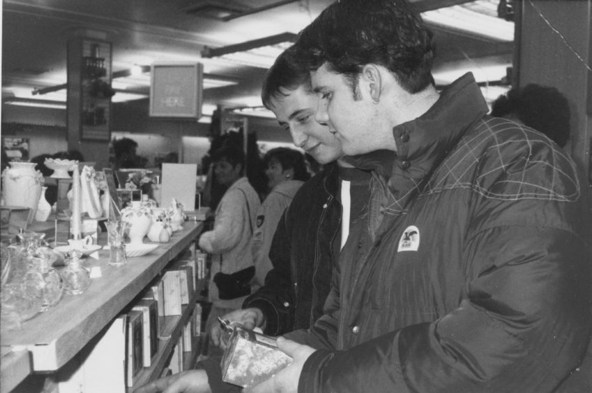 1991: Unlikely lads: offshore worker Kevin Stewart, (left), has made a Christmas shopping list this year. Salesman Steve Ross-Munro, (right), can't be bothered with Christmas this year.