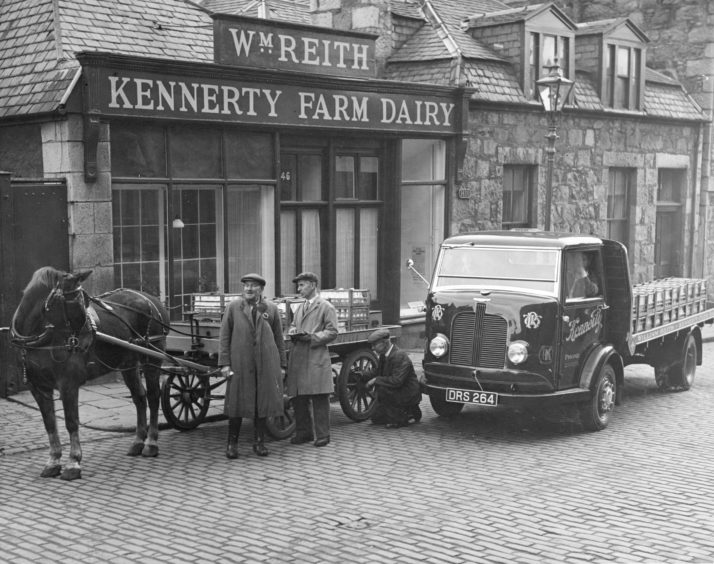 1950: The old and new methods of transport for delivering milk seen here in 1950.