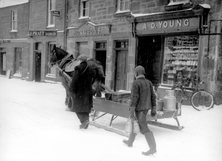 1950s: A hard winter in the North-east lead to a sledge being presses into service to deliver milk. This print, from an uncaptioned glass slide in our archive, possibly dates from the 1950s.