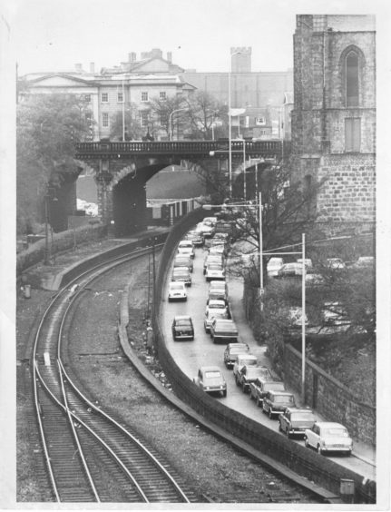 1975: Pictured is a heavy build up of traffic at rush hour in the Denburn.