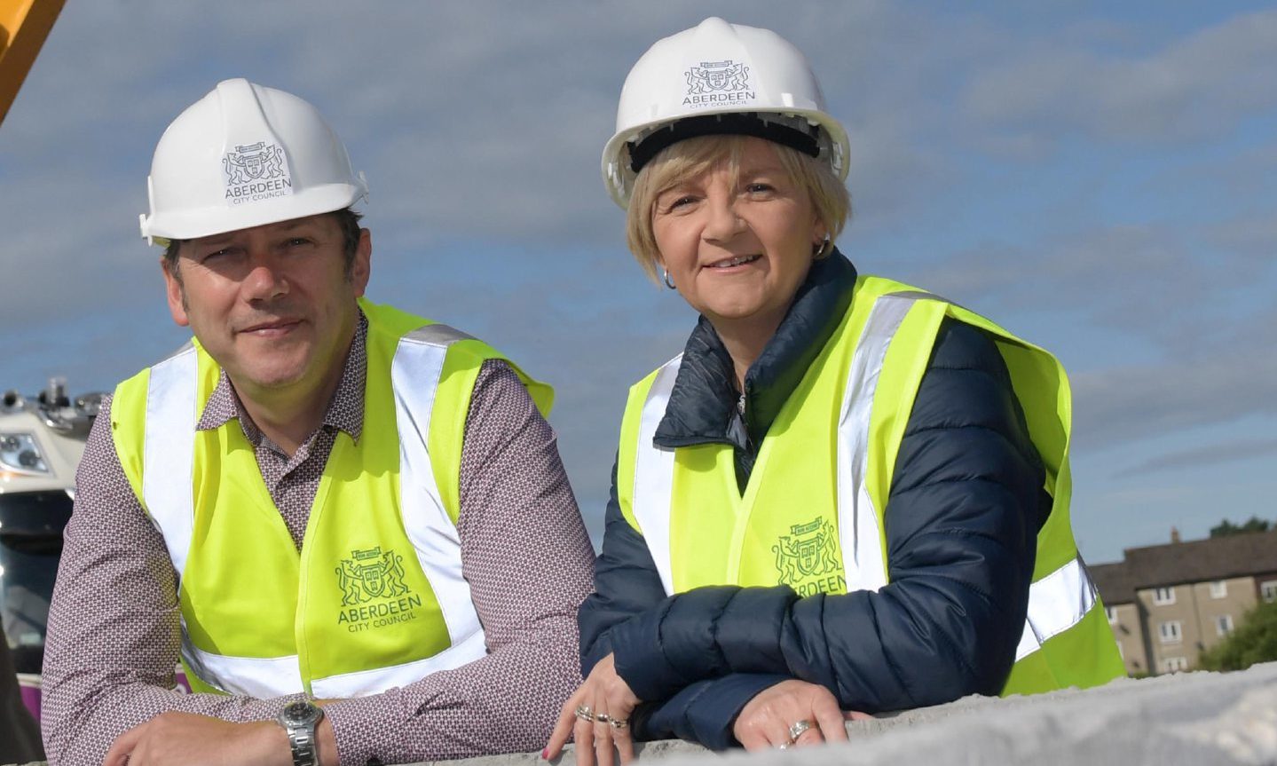 Douglas Lumsden and Aberdeen Labour's Jenny Laing - then council co-leaders - at the former Summerhill Academy site, which is being used for council housing - a key Labour manifesto pledge.