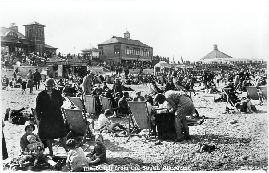 The Beach Shelter, with clock tower, can be seen in the background of this image. In addition to sheltering from the wind and rain, it was used as a landmark for reuniting youngsters separated from parents and as a meeting place before nights out at the nearby Beach Ballroom.