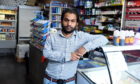 Muja Hid Ali tackled the knife-wielding thug as he tried to flee the shop.