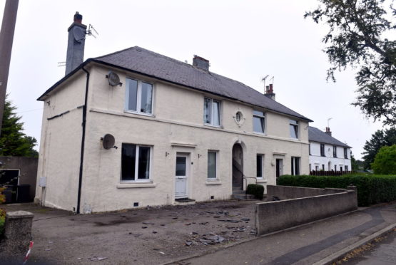 Slates could be seen strewn across the ground outside the block on Middlefield Crescent.