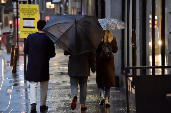 Shoppers brave the rain in Aberdeen.