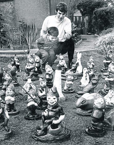 1972: Aberdeen man David Dinardo shows off some of the gnomes he has made to his nephew, Paul Dinardo, 5. David sold the gnomes he made to help raise cash for charity.