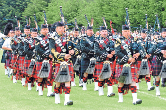 Pipers proudly parade into the park for the games