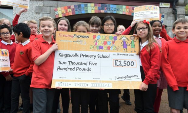 Pupils from Kingswells Primary School with their cheque for £2,500.