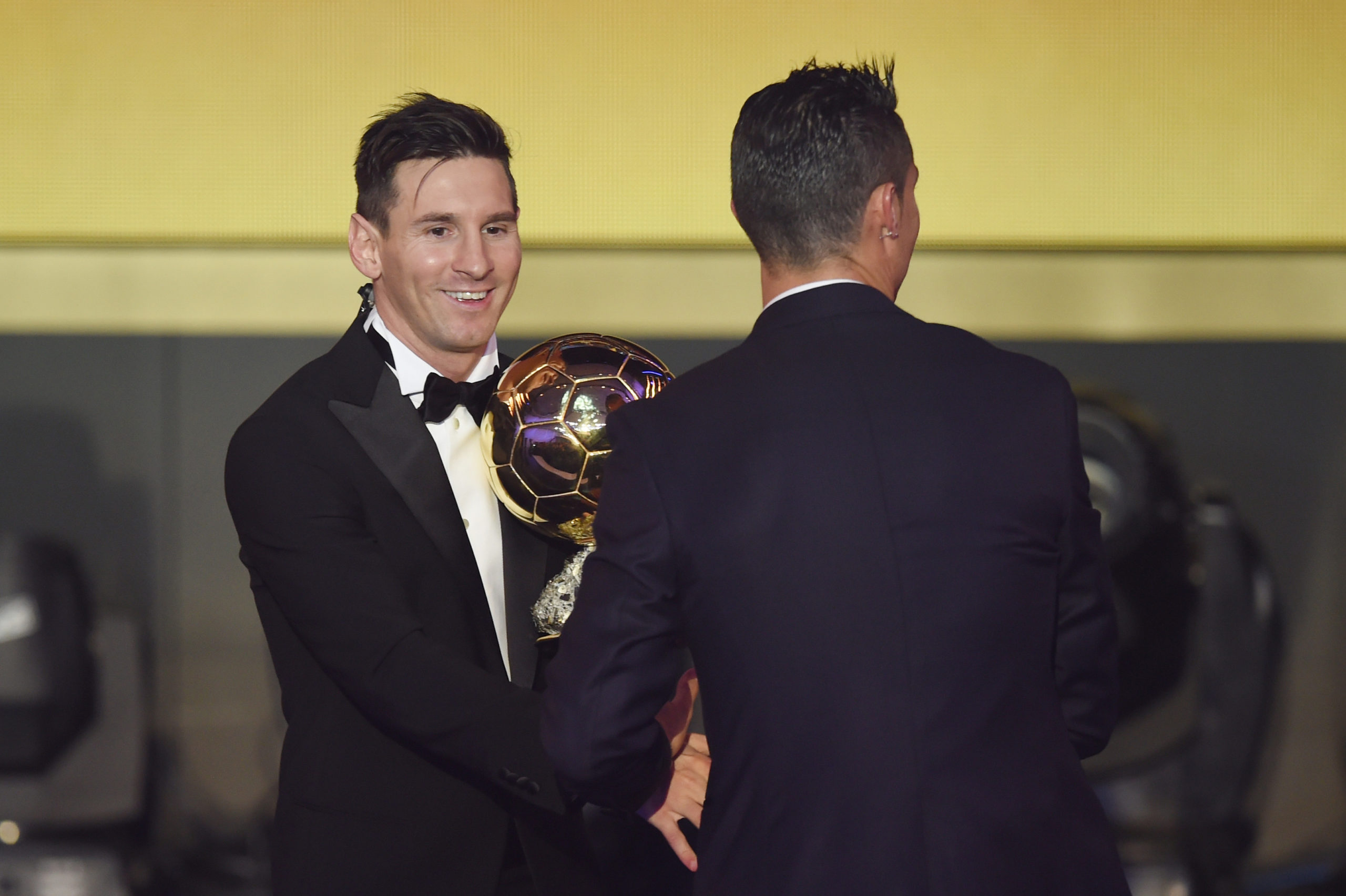 RIVALS: Ballon d’or winner Lionel Messi, left, is congratulated by Cristiano Ronaldo.