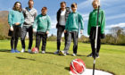 Dons players Mark Reynolds and Peter Pawlett play footgolf at Hazlehead with pupils from Hazlehead Primary School.