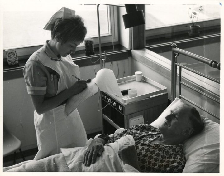 Mr William Gordon has settled in his ward and Nurse Oliphant takes routine arrival notes."Used: P&J 29/07/1970