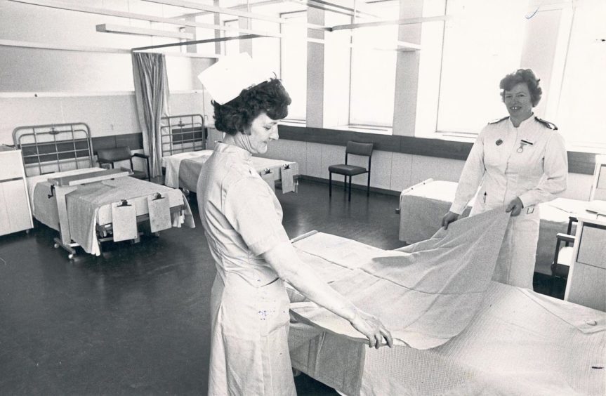 Auxiliary nurse Emma Gray, left, and Sister Eileen Marshall make up a bed in a new ward at Foresterhill Hospital