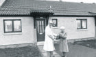 Margaret Shearer receives the keys to the first Scottish Special Housing Association house to be occupied after being built on the site of the old Orlit type