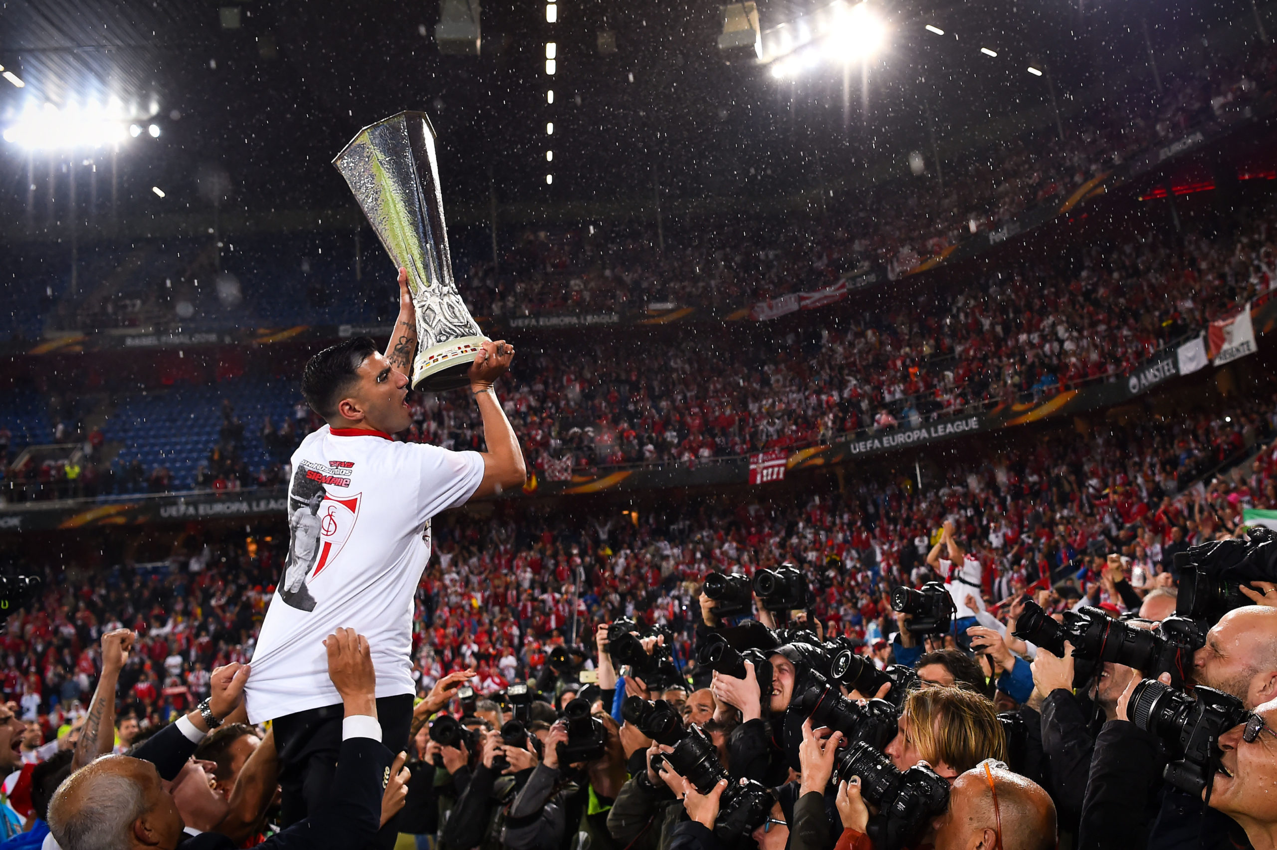 Team captain Jose Antonio Reyes of Sevilla FC poses for photographers with the trophy after the UEFA Europa League Final