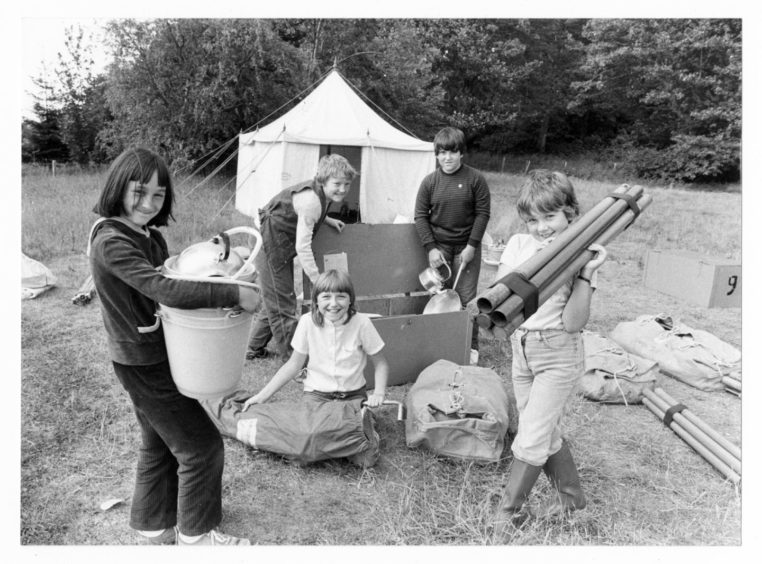1982: The 33rd Aberdeen Girl Guides along with a few Guides from the 40th Mannofield and 1st Parkway (Bridge of Don) set up camp this week out at Crathes, here a few of the girls are unloading their gear. Left to right - Kim Grant (11), Mandy Brodie (12), Cherron Leys (11), Sandra Rutherford (13), Jennifer Brown (11).